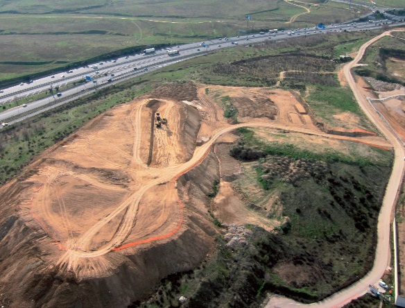 Machinery excavating earth for the foundation landfills.